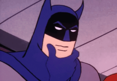 Batman se questionne en se caressant le menton