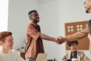 A man is shaking someone else's hand. - Eventdrive Blog Article